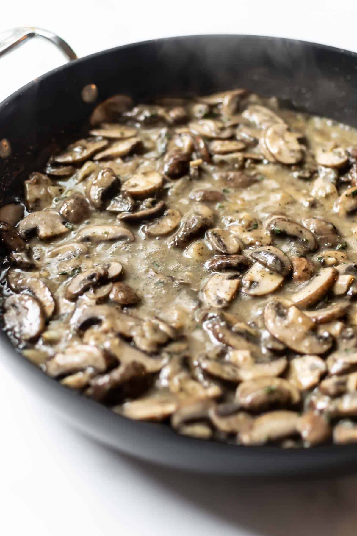 cooked mushrooms in a black skillet