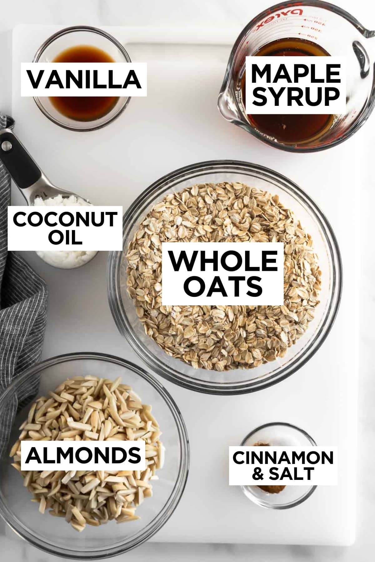 ingredients for homemade granola in bowls with overlay text.