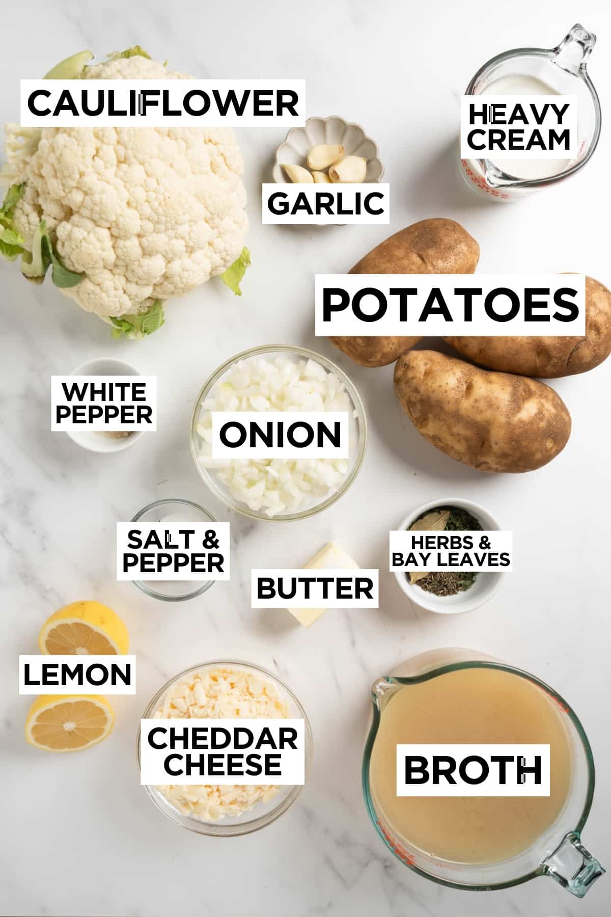 ingredients for creamy cauliflower potato soup in bowls.