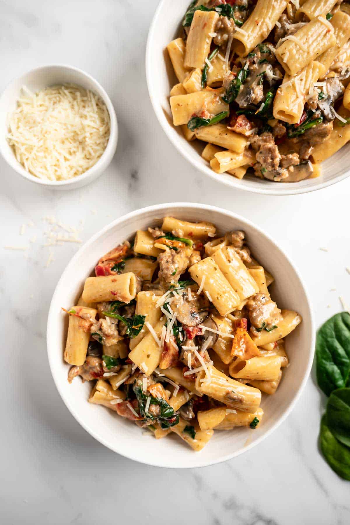 two bowls of tuscan sausage pasta.