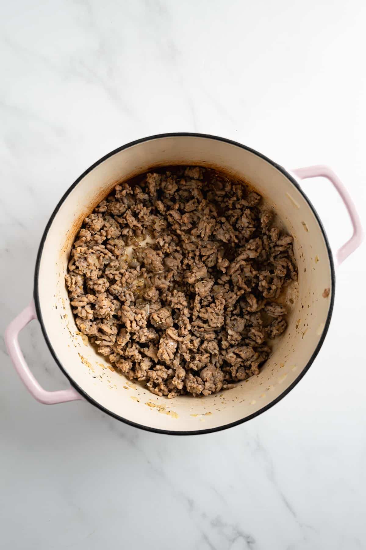 ground sausage in a pink pot.