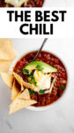 toppings on a bowl of chili with a spoon with overlay text.