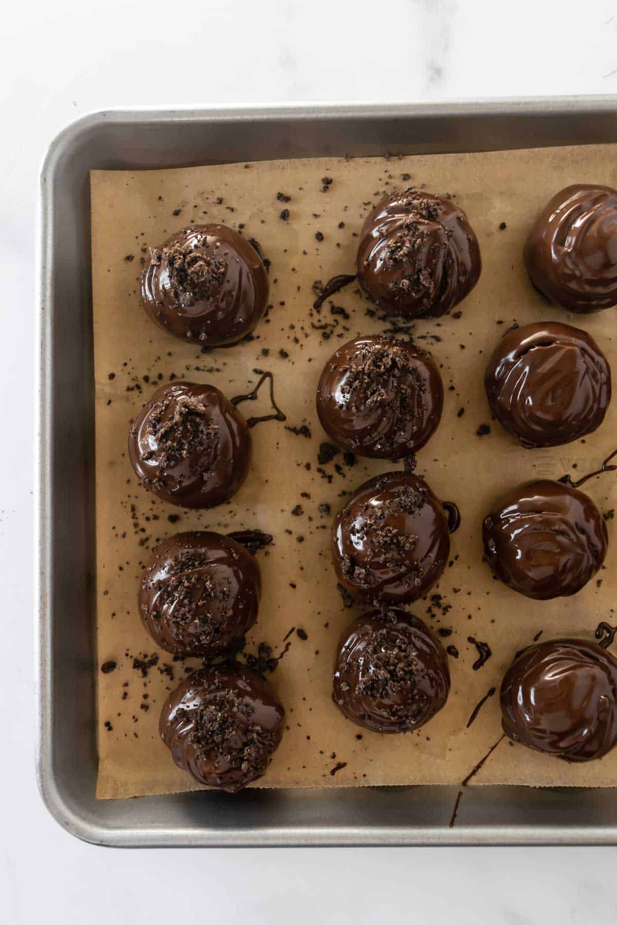 Oreo balls dunked in chocolate and topped with crushed Oro cookies.