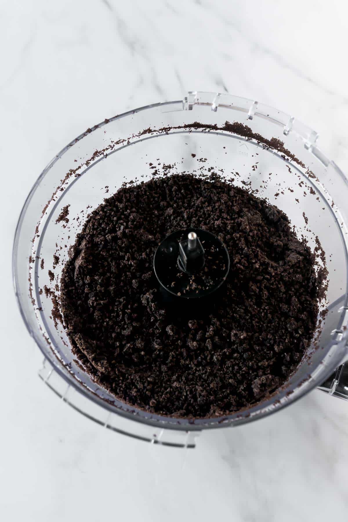 Oreo crumbs in a food processor.