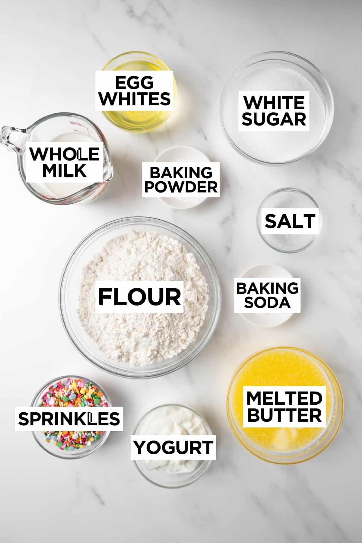 ingredients for funfetti cupcakes in bowls with overlay text.