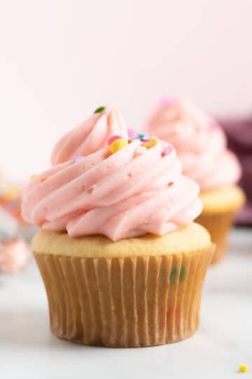 funfetti cupcake with pink frosting and sprinkles.