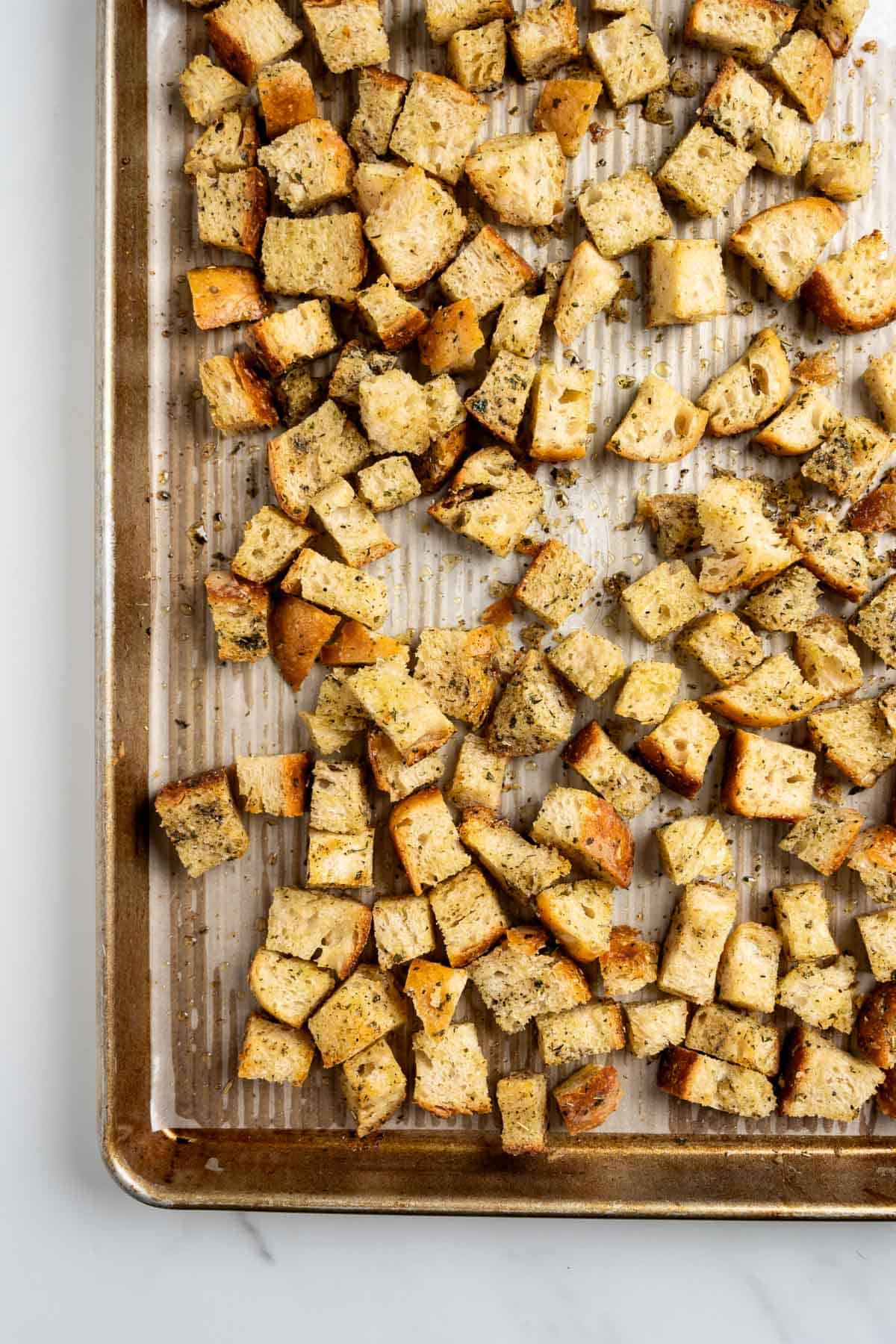 homemade croutons on a baking sheet.