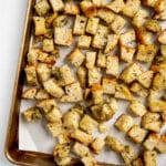 baked croutons on a sheet pan.