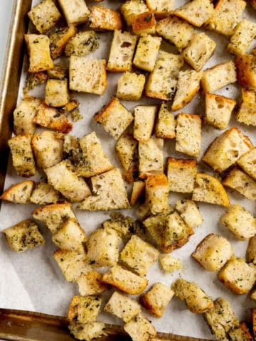 baked croutons on a sheet pan.