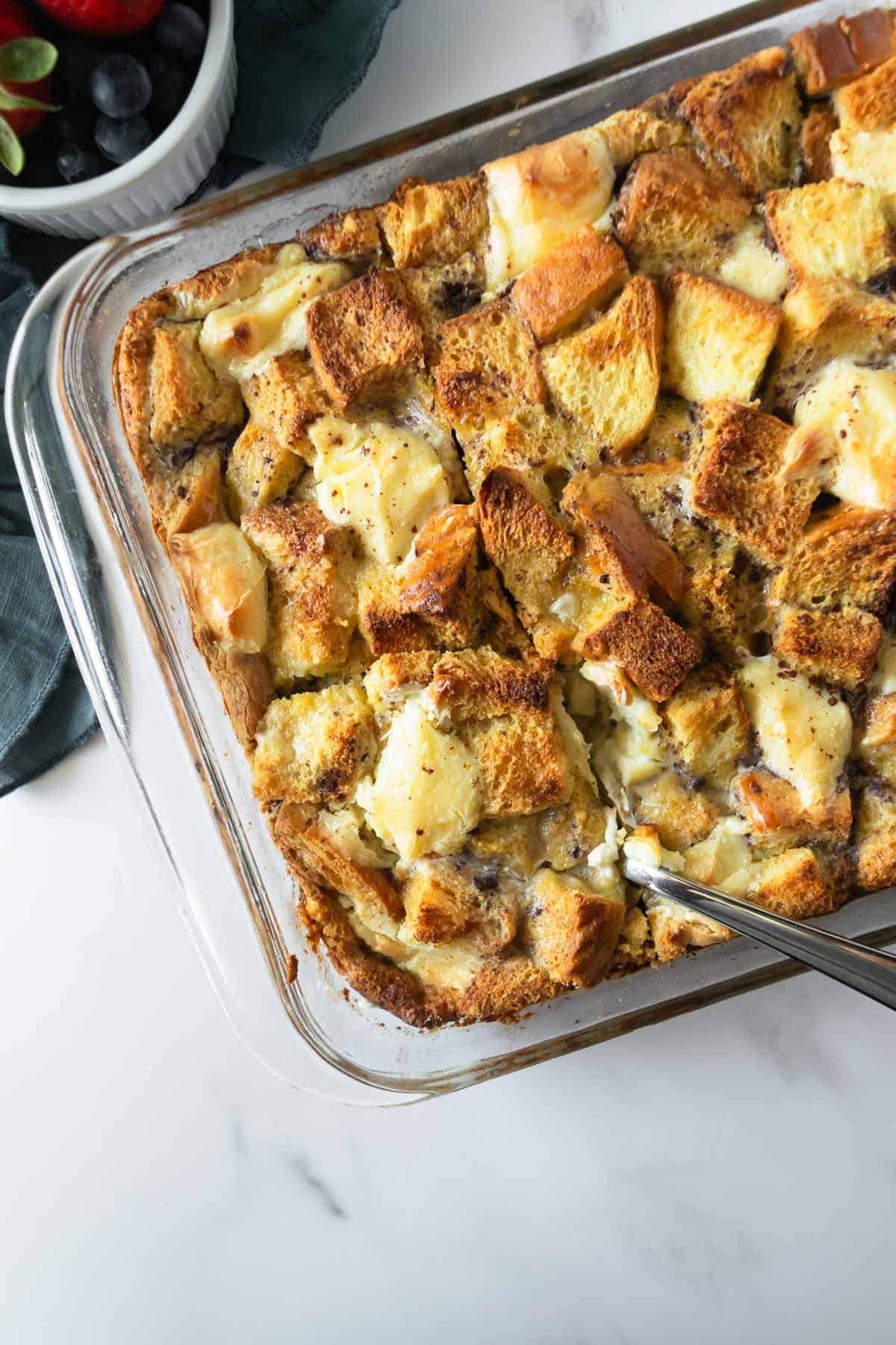 baked French toast casserole in a glass baking dish.
