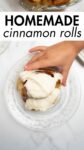 a hand grabbing a cinnamon roll on plate with overlay text.