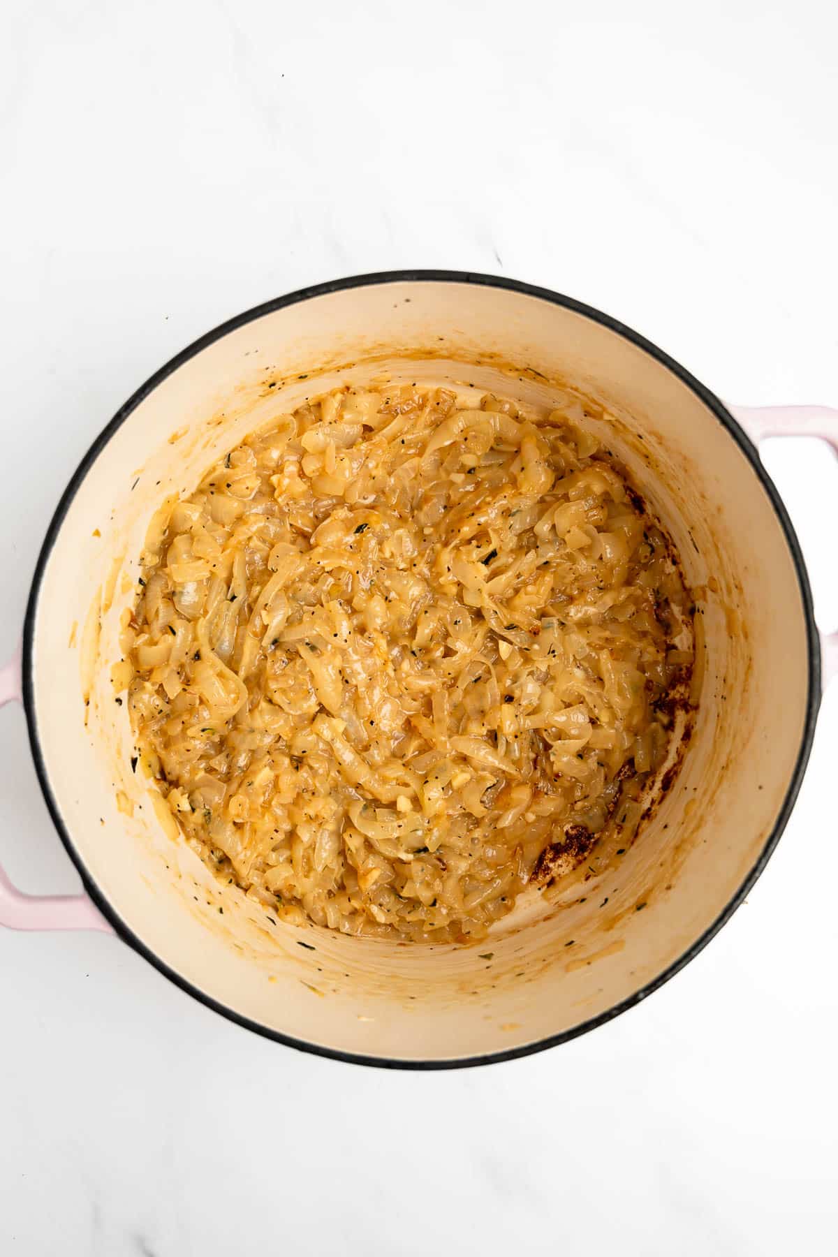 sliced onions caramelized in a pot.