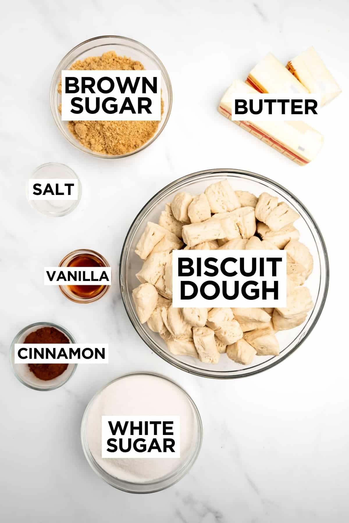 ingredients for monkey bread in bowls with overlay text.