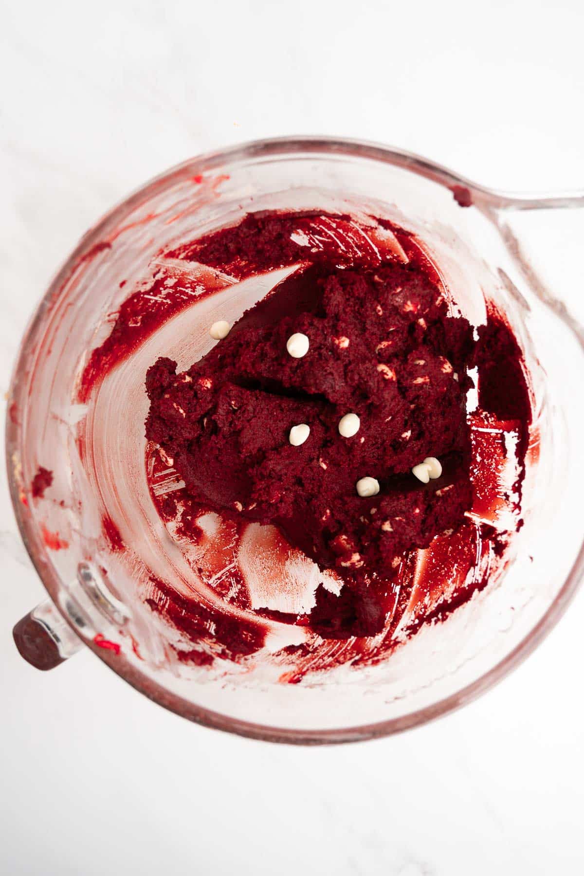 red velvet cookie dough in a mixing bowl.