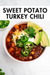 sweet potato turkey chili in a bowl with toppings with overlay text.