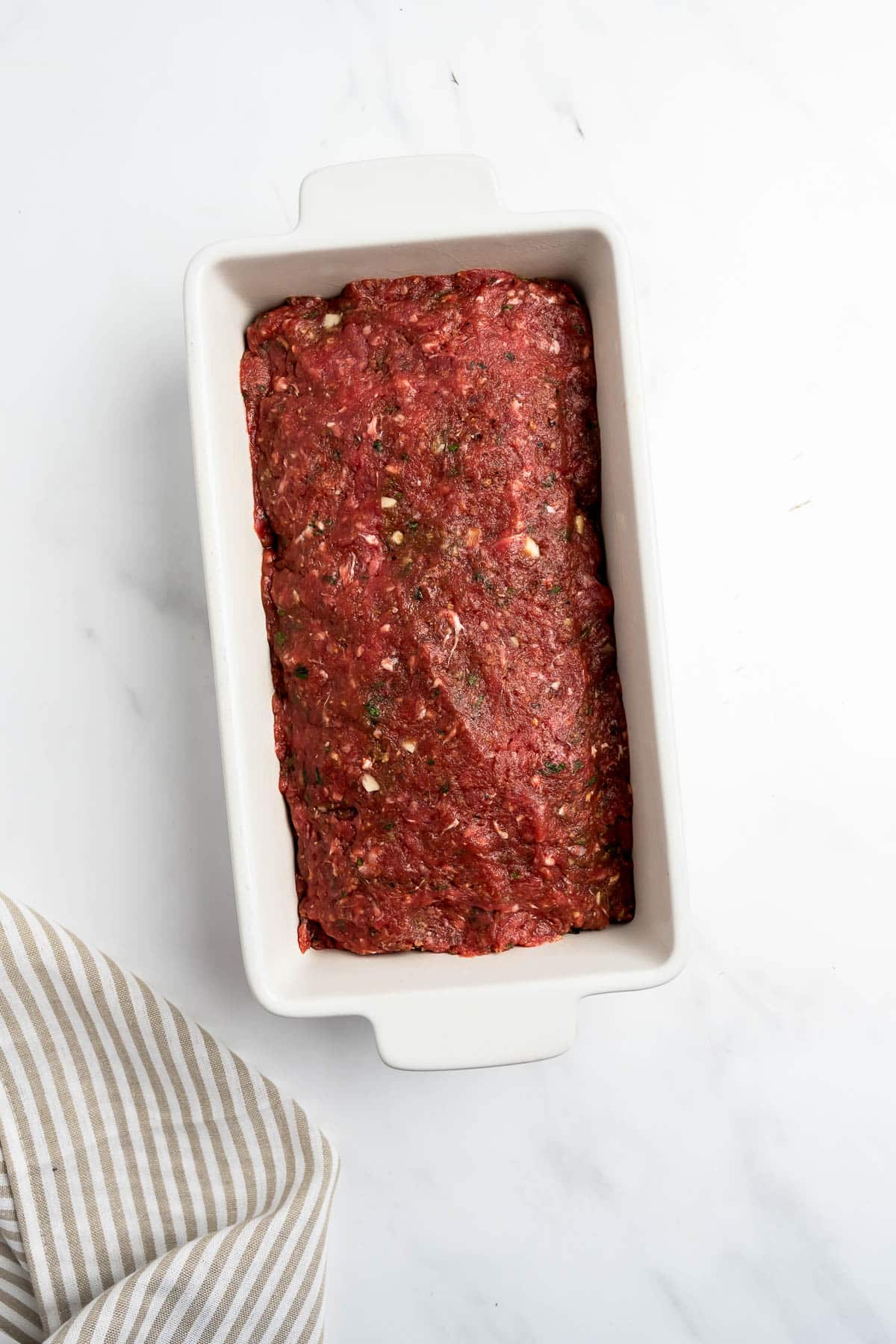 meatloaf in a white baking dish.