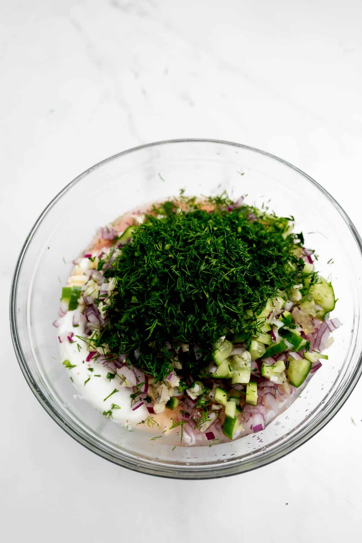 Tzatziki sauce ingredients in a bowl.