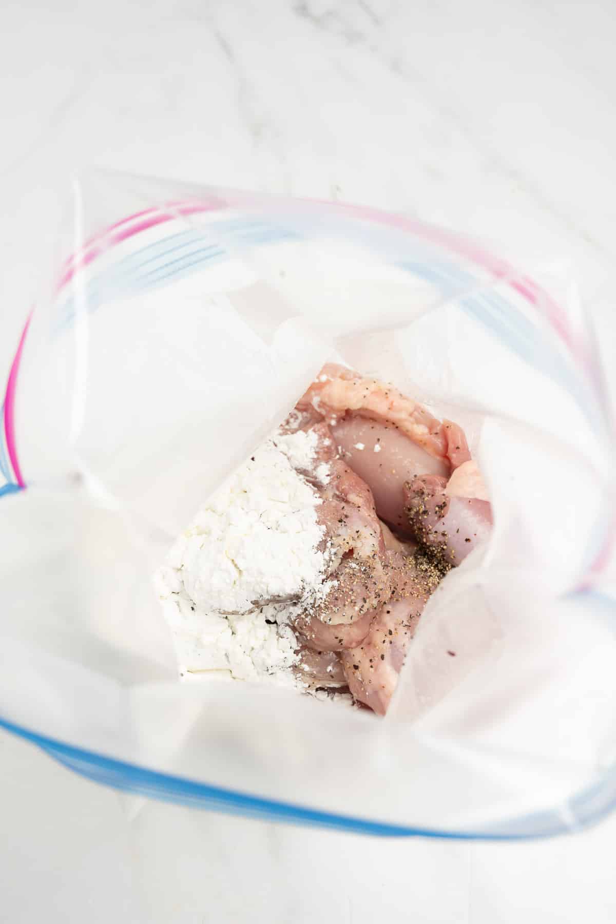 chicken thighs in a zip-top bag.